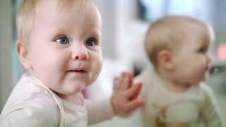 Infant Baby With Blue Eyes Looking Mom Little Girl Biting Her